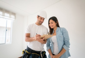 Contractor explaining the benefits of acrylic walls to a homeowner